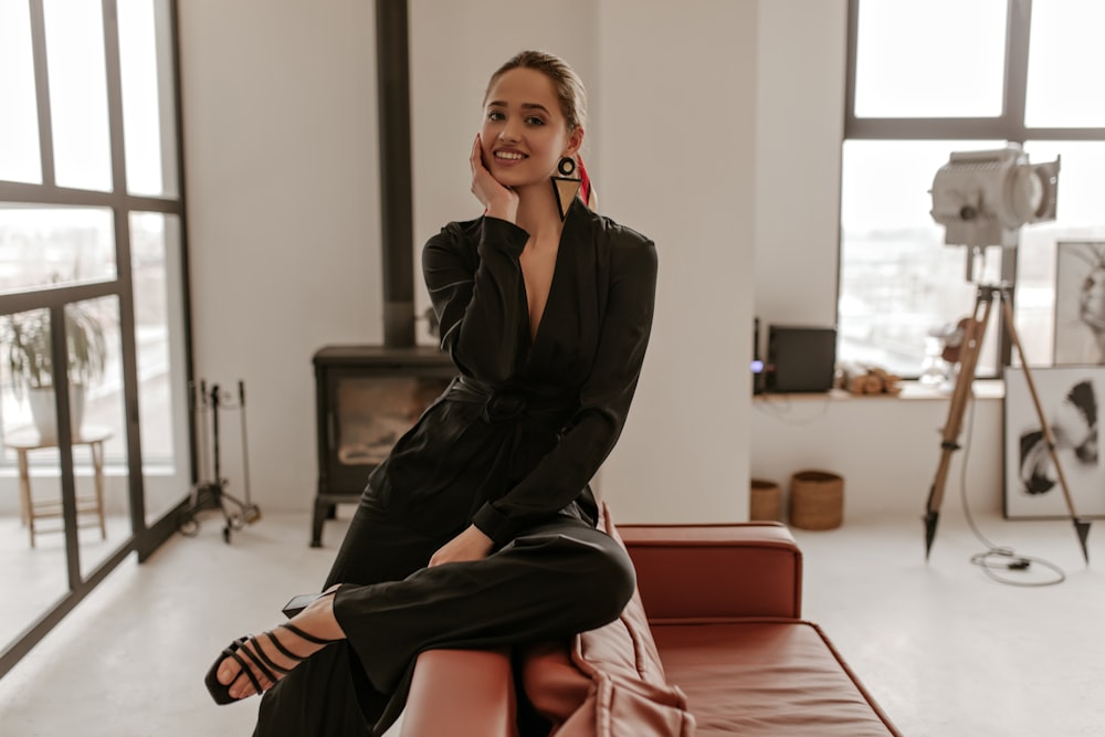 a woman sitting on a couch in a room