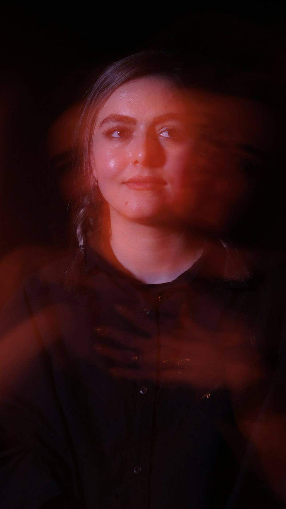 a blurry photo of a woman in a dark room