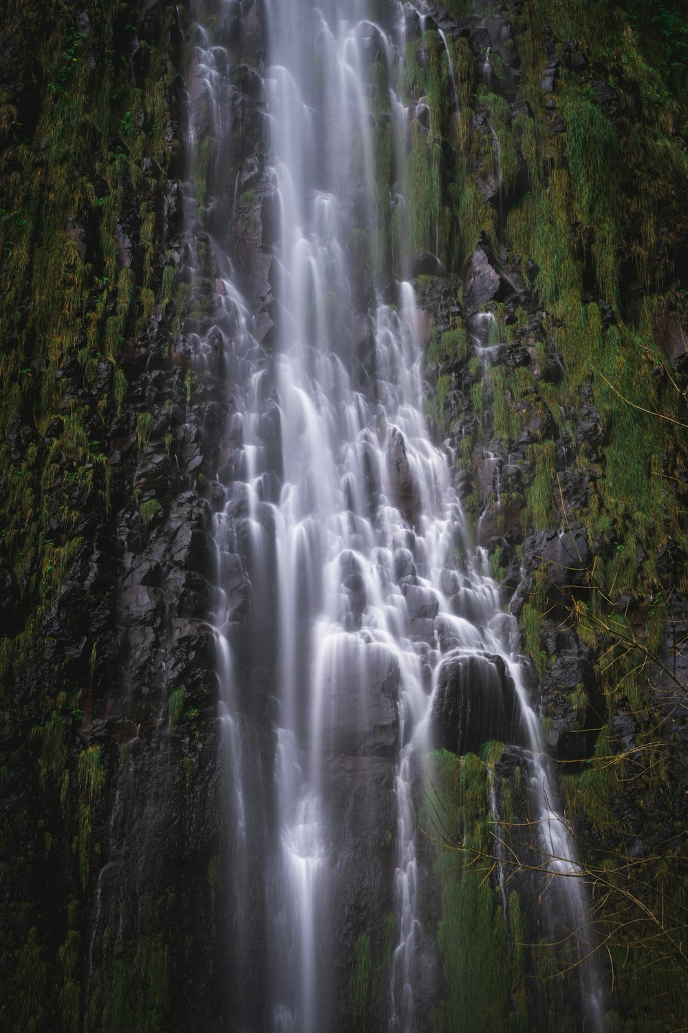 a very tall waterfall with lots of water