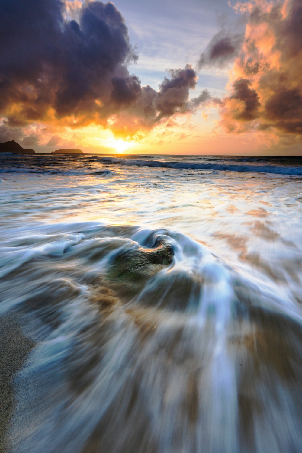 a picture of a sunset over the ocean