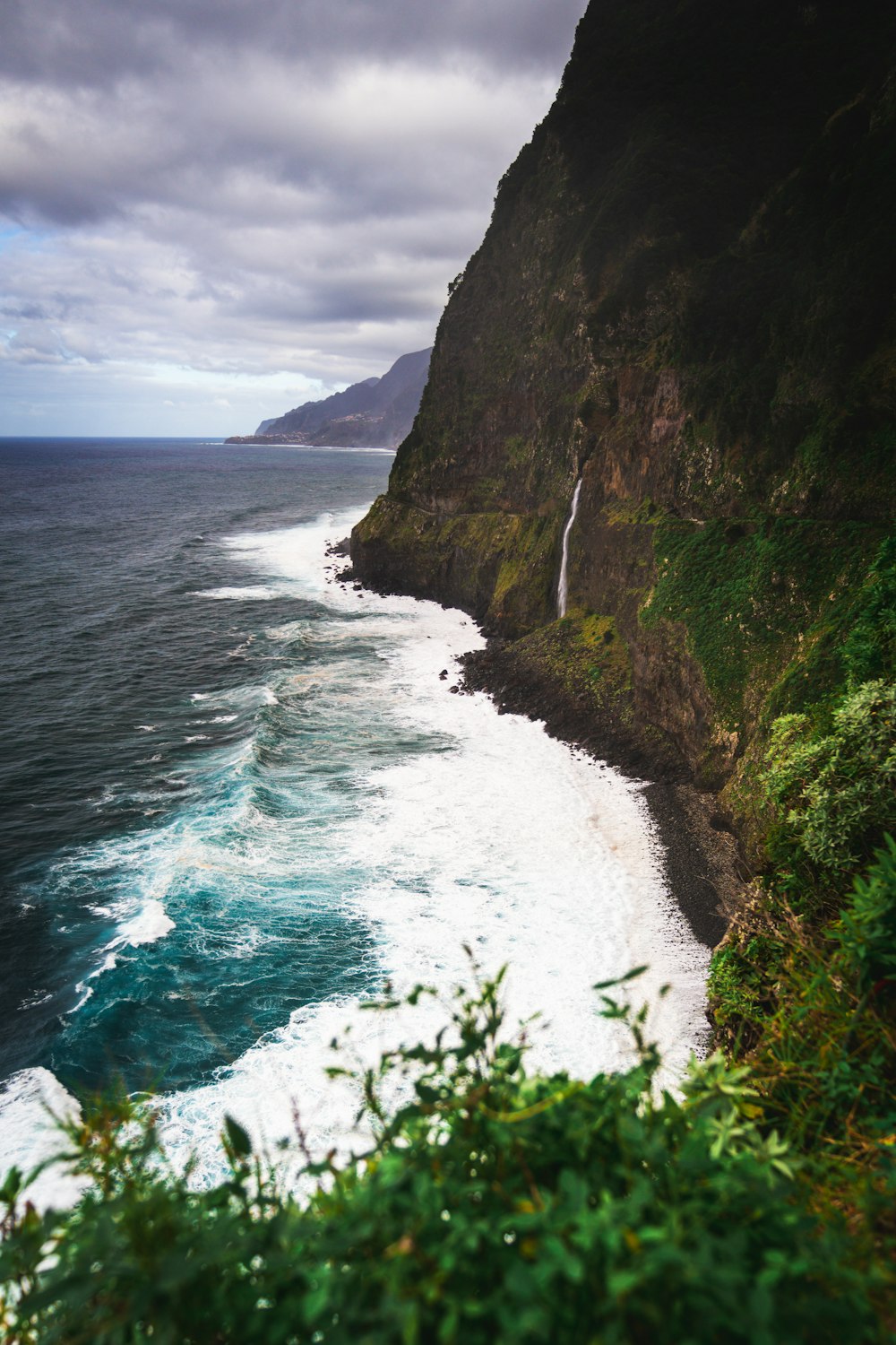 a view of the ocean from a cliff