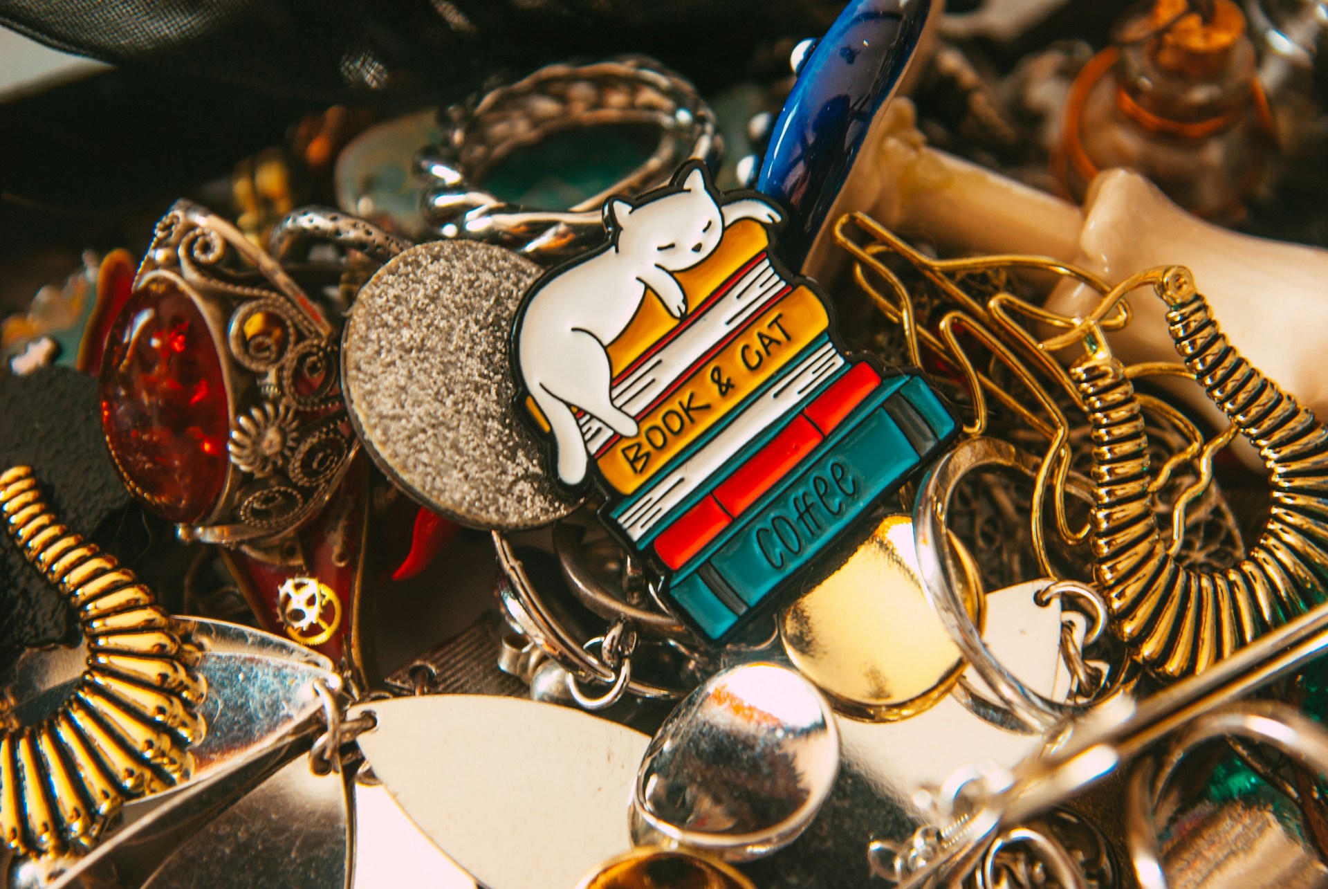 a pile of assorted key chains and charms