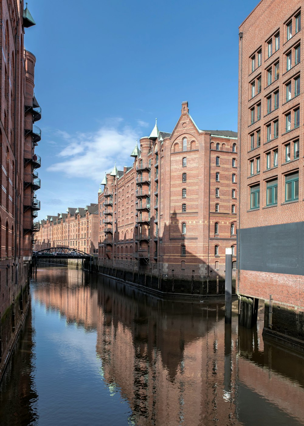 a river running through a city next to tall buildings