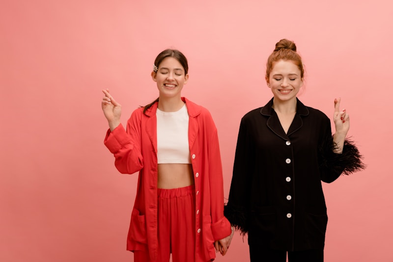 Luxury duo posing in vibrant pink