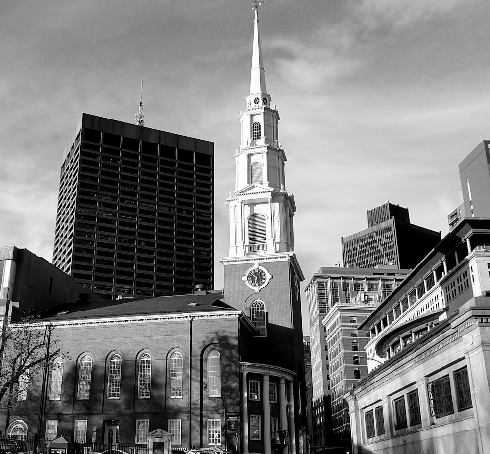 a black and white photo of a church in a city