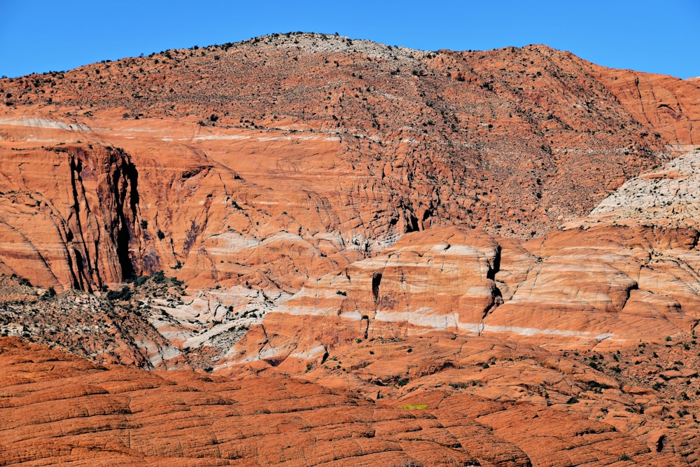 a large mountain with a very tall rock formation