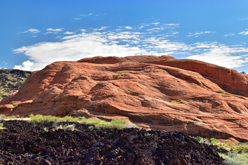 a large rock formation in the middle of a desert