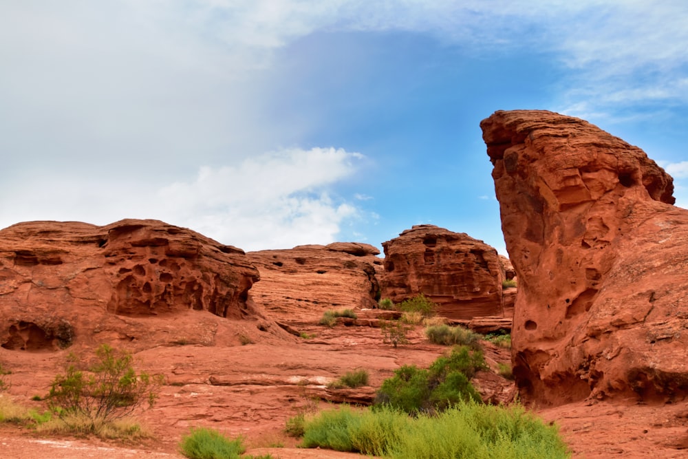 a large rock formation in the middle of a desert