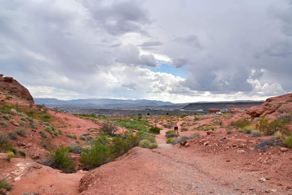 a dirt road in the middle of a desert