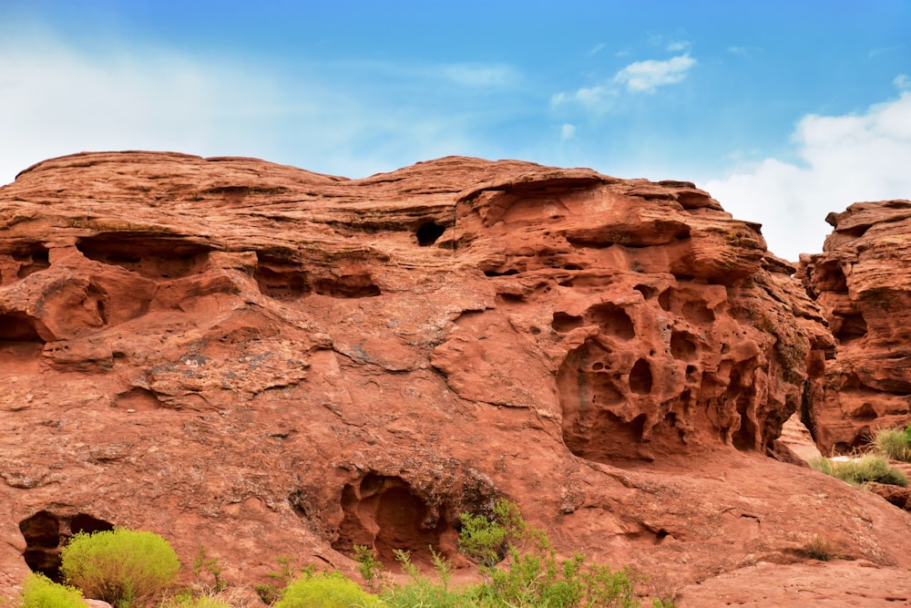 a large rock formation in the middle of a desert