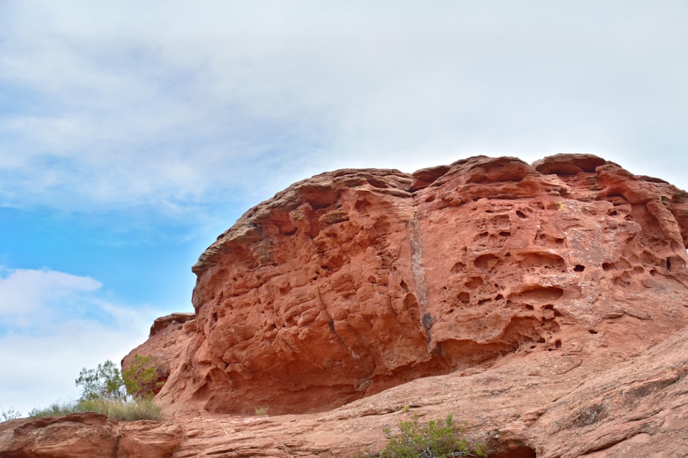 a large rock formation in the middle of a desert