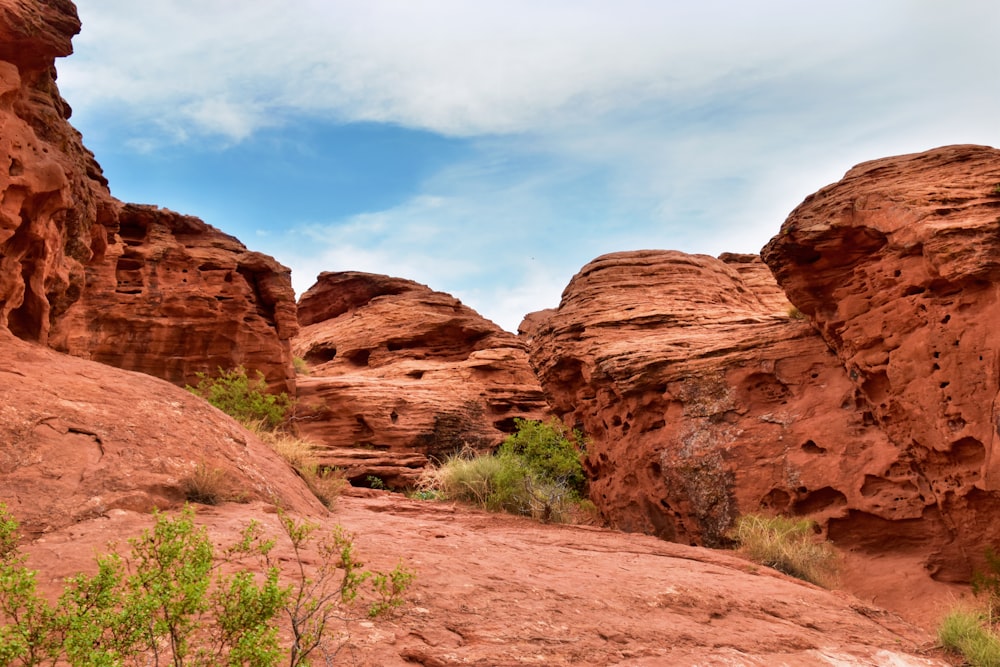 a large rock formation with a sky background