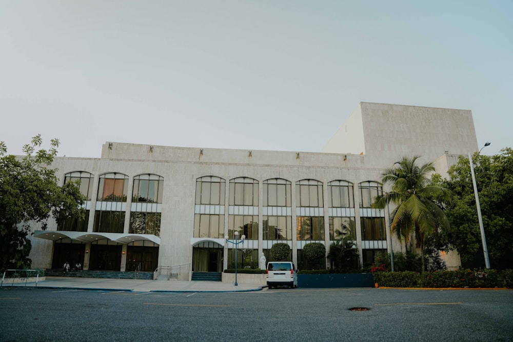 a large building with a car parked in front of it