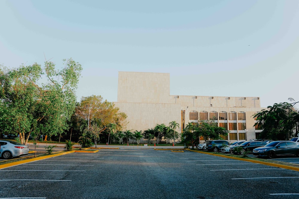 a parking lot with a building in the background