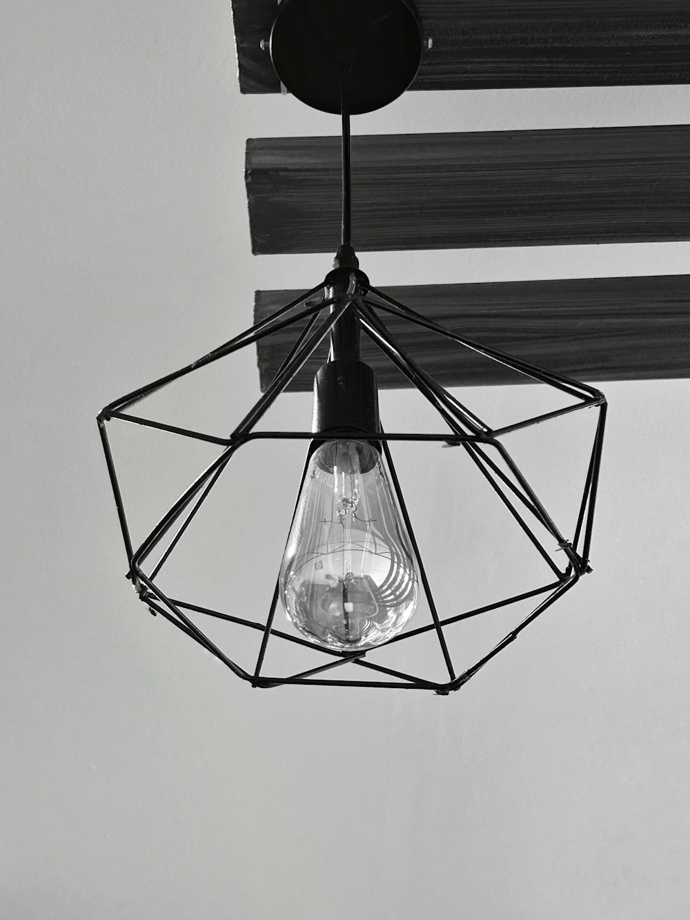 a black and white photo of a light fixture