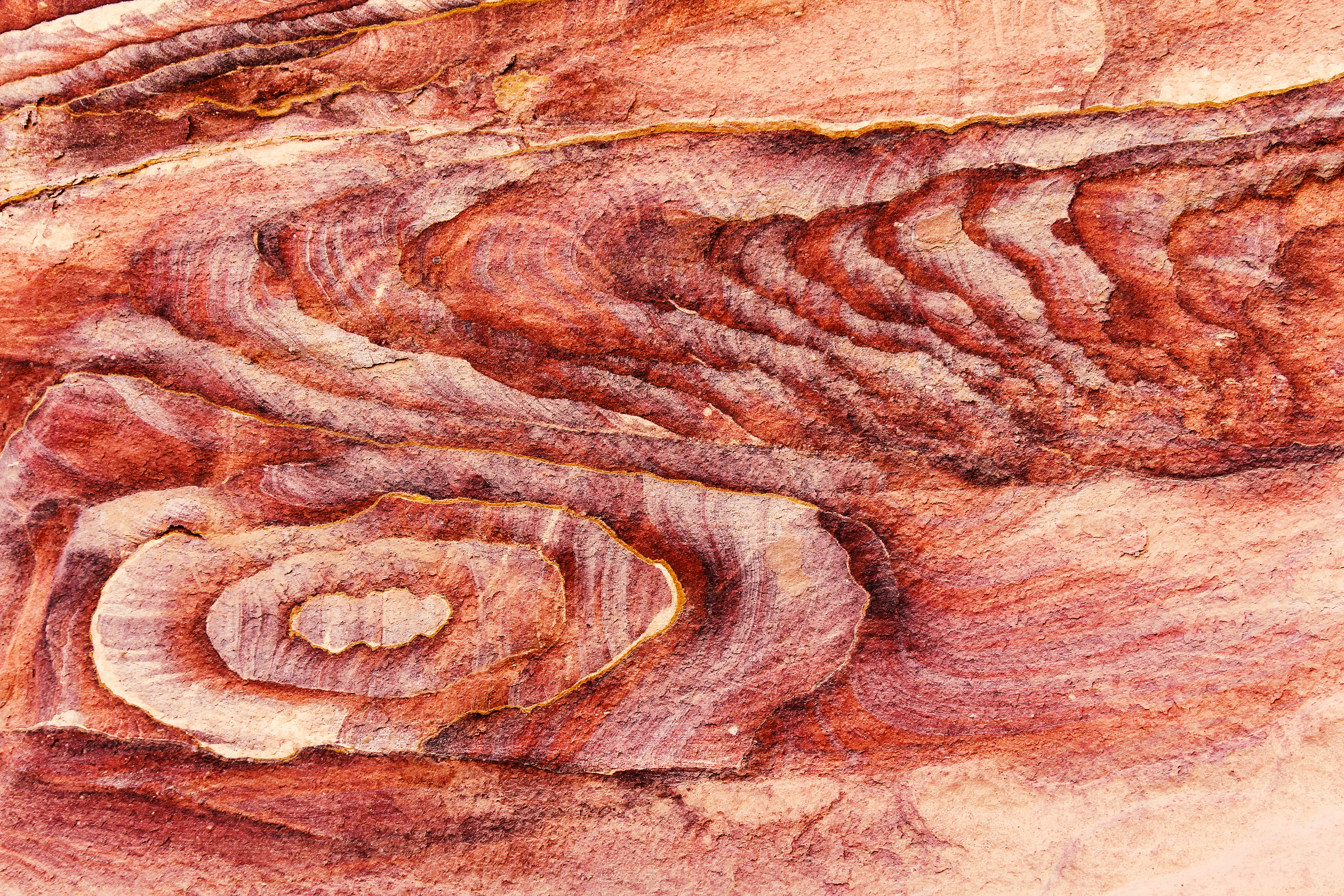 a close up of a rock formation with a heart in the center