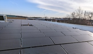 the roof of a building with a lot of solar panels on it