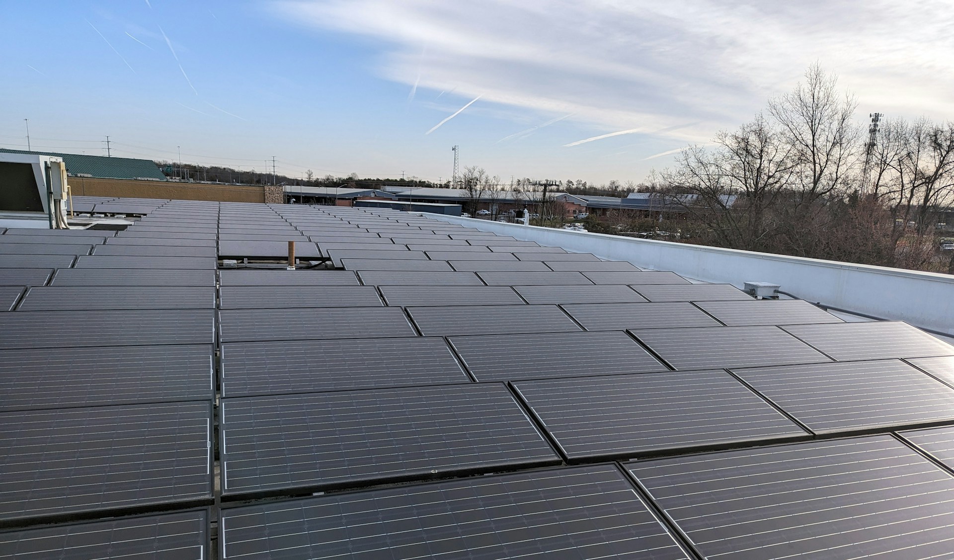 the roof of a building with a lot of solar panels on it