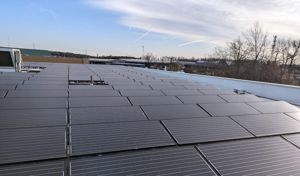 the roof of a building with a lot of solar panels on it