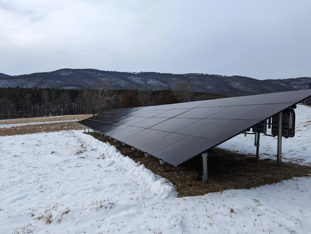 Elbert County · 11.2 kW — Elevated racking shedding a March snow