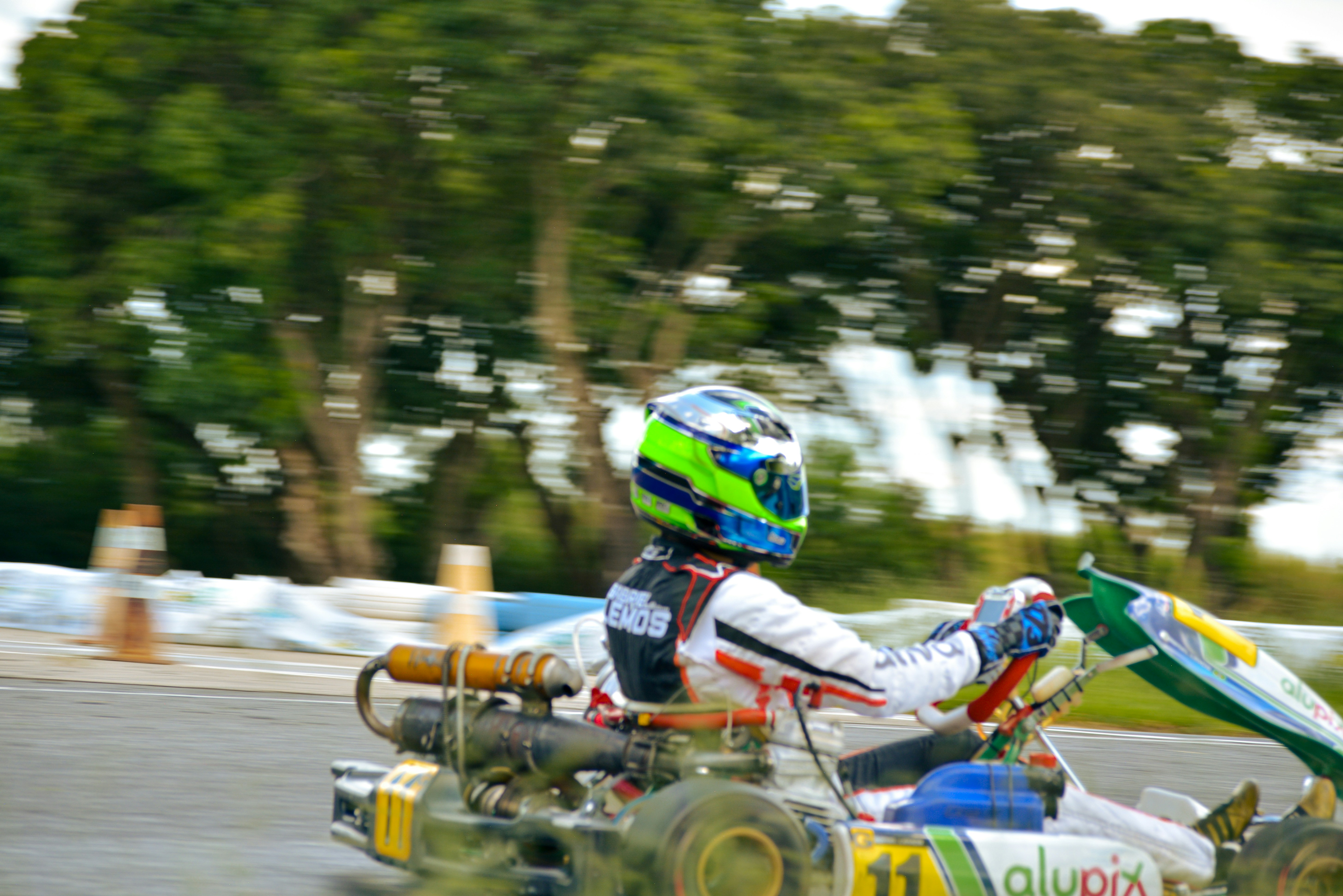 Person riding a go-kart on a track