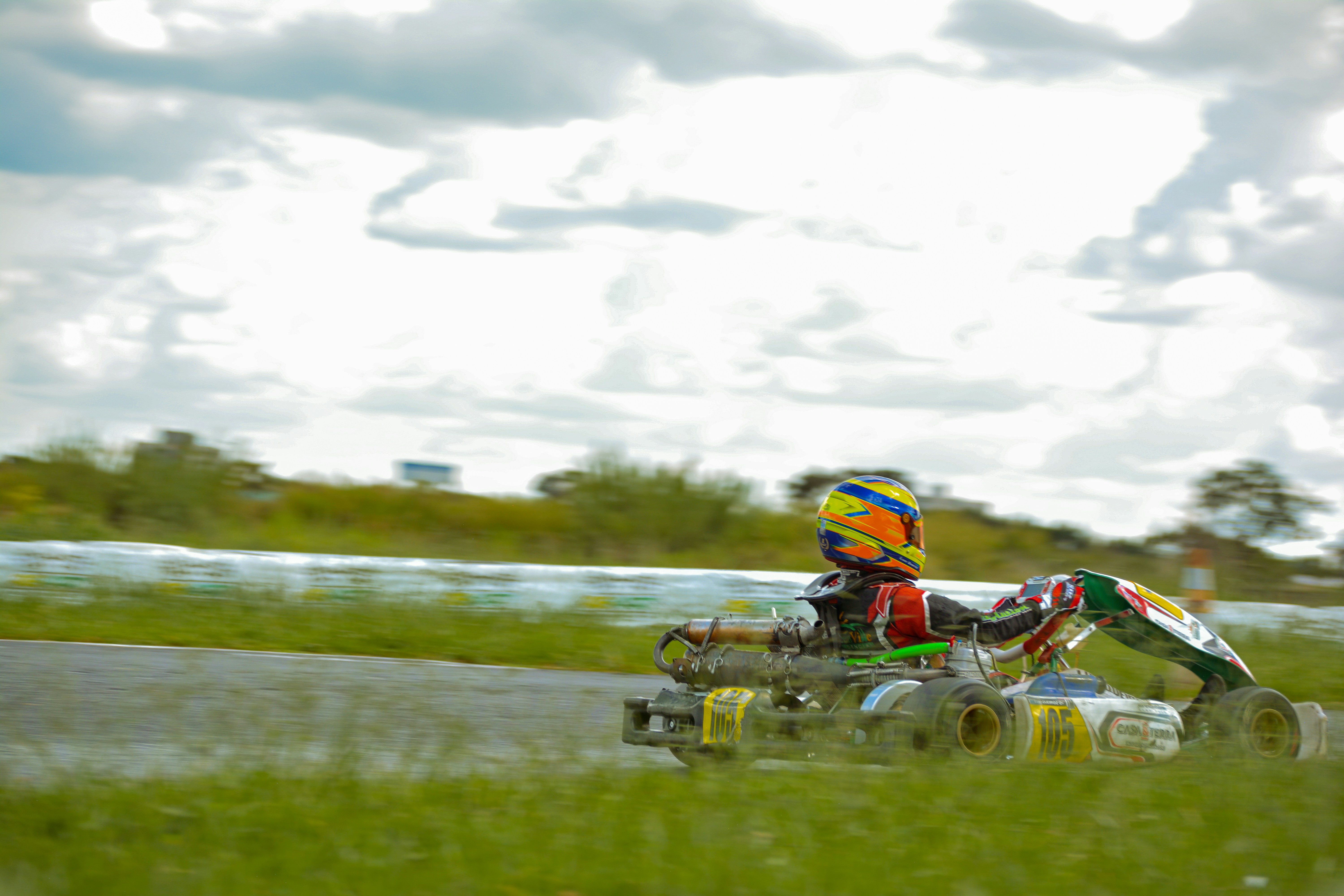 a person riding a toy car on a track