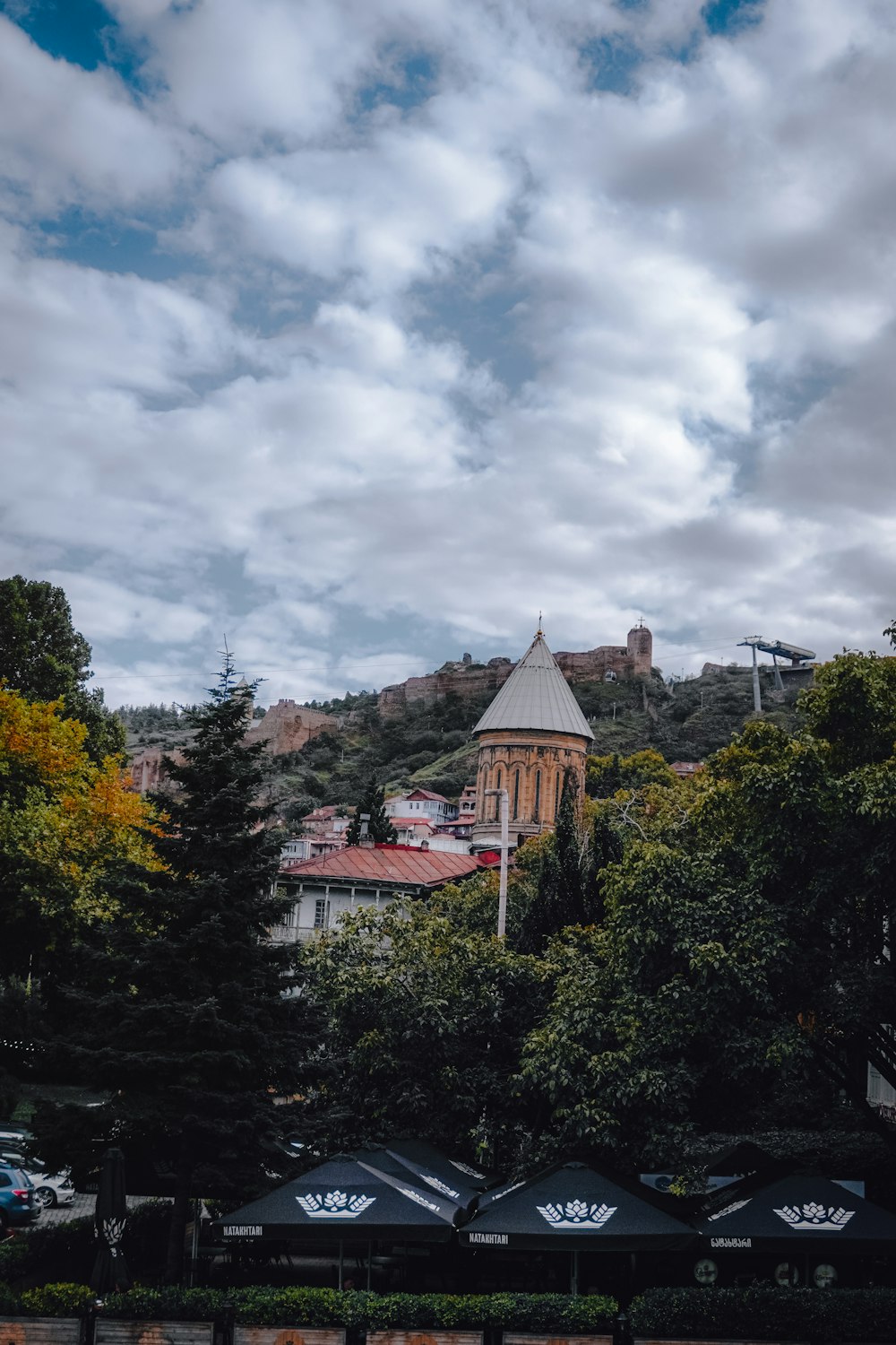 a view of a building with a clock tower in the background