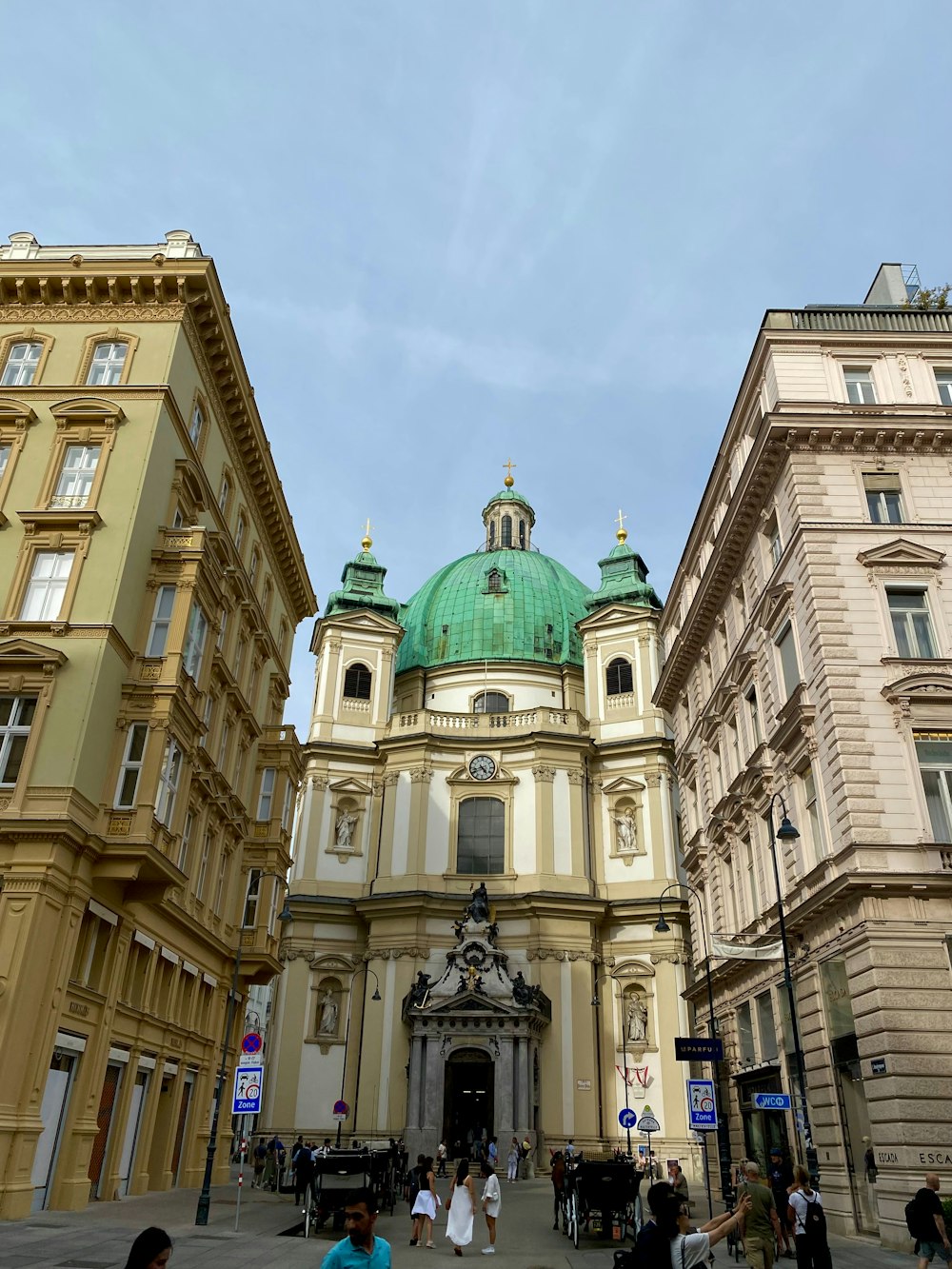 a large building with a green dome on top of it