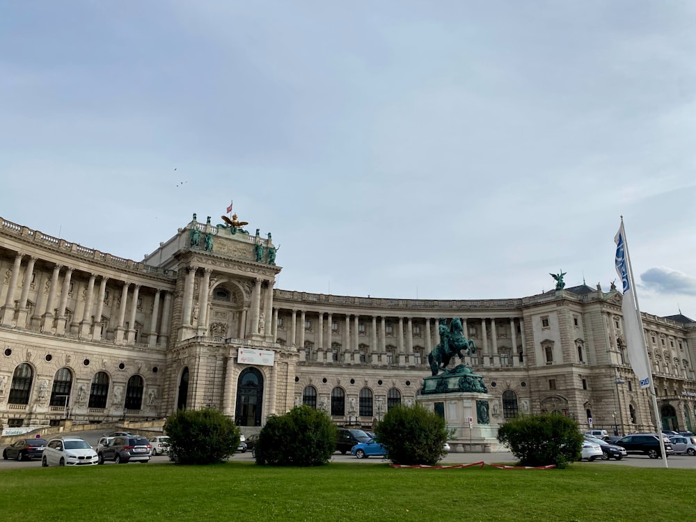 a large building with a statue in front of it