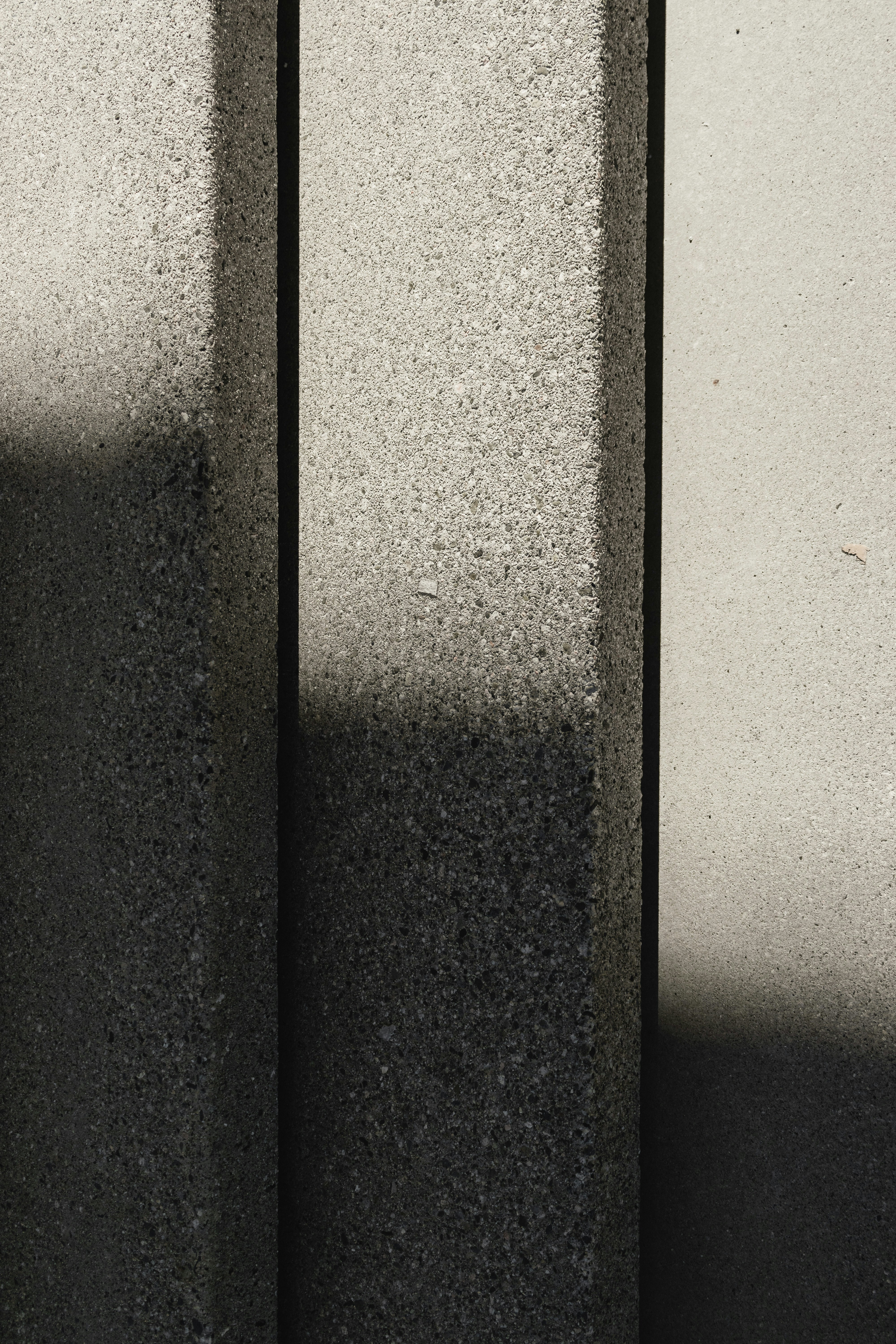 a black and white photo of a clock on a wall