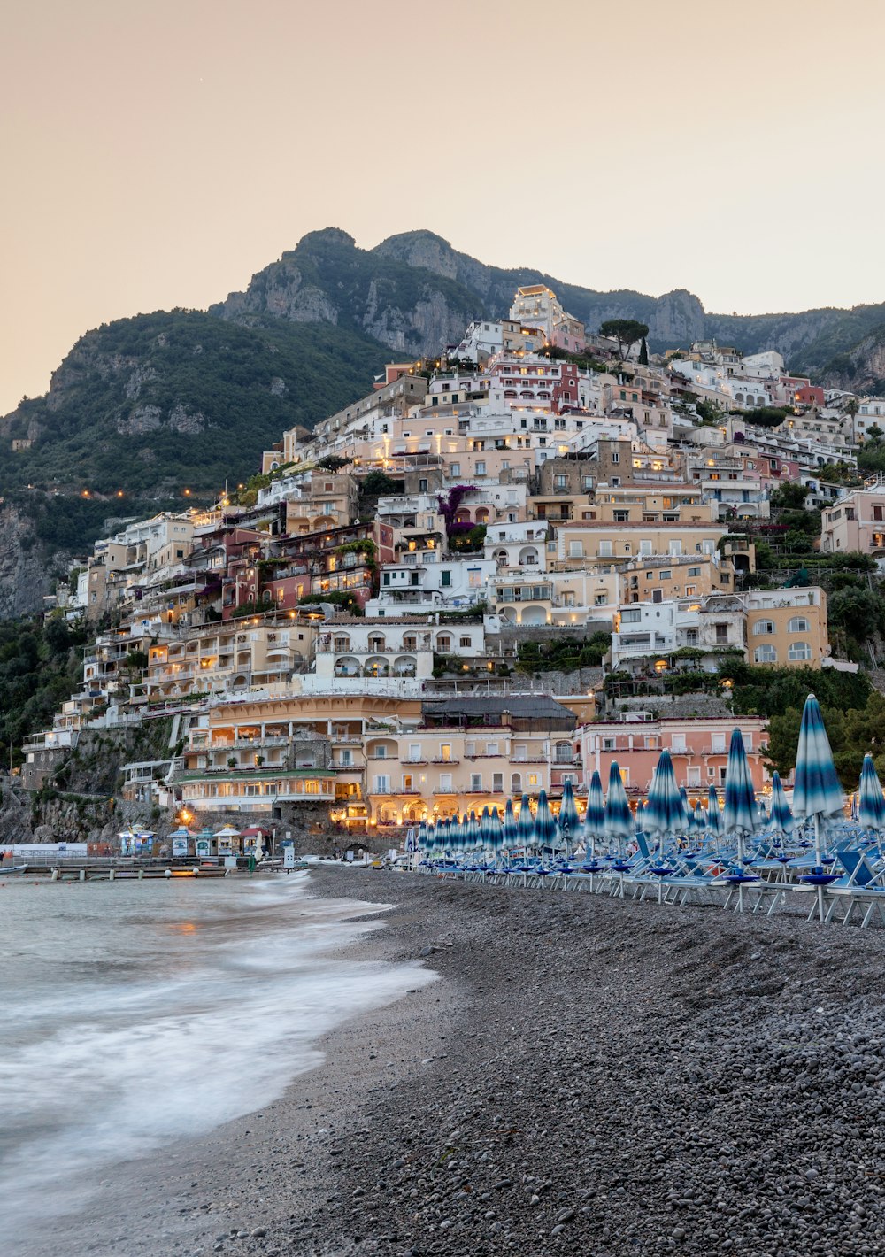 a beach with a bunch of umbrellas on it