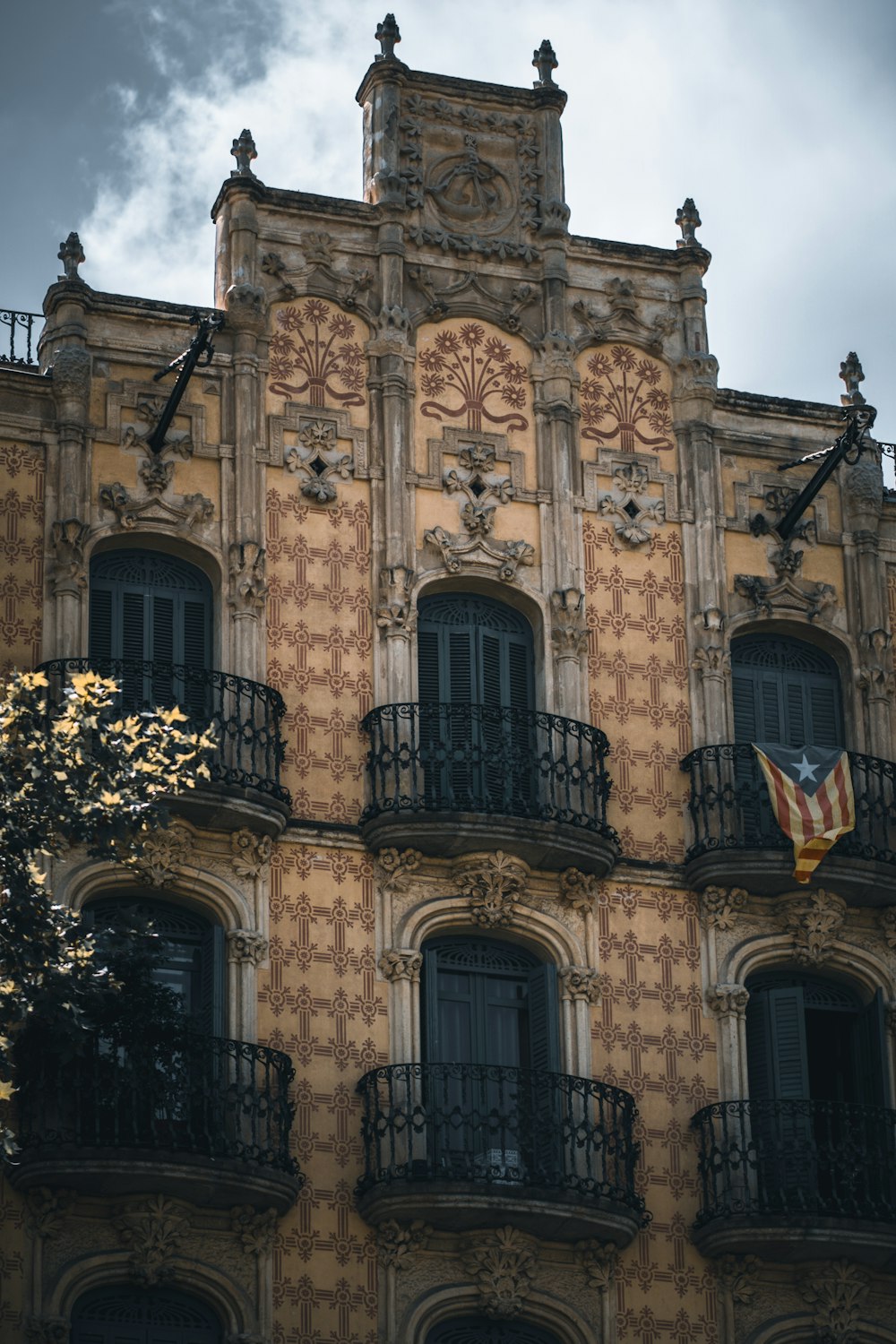 a tall building with many windows and balconies