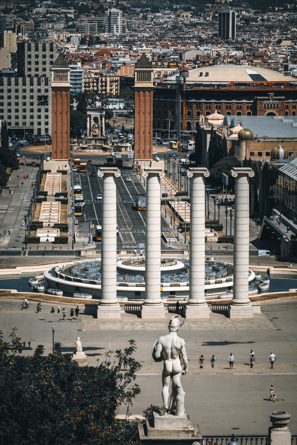 a statue of a man is in the middle of a plaza