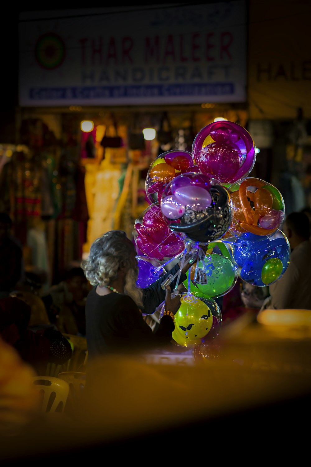 a bunch of balloons sitting on top of a table