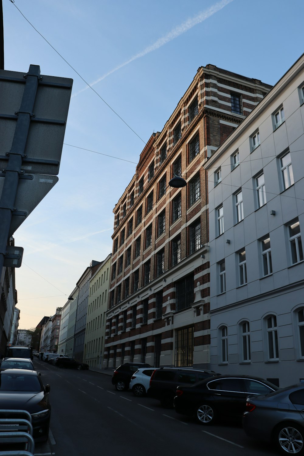 a street with cars parked on the side of it