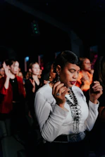 a woman standing in front of a crowd of people