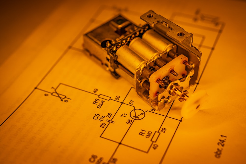 an electrical device laying on top of a blueprint