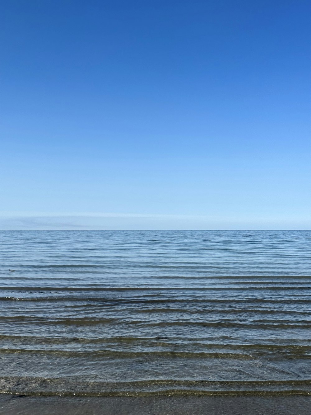 a view of the ocean from a beach