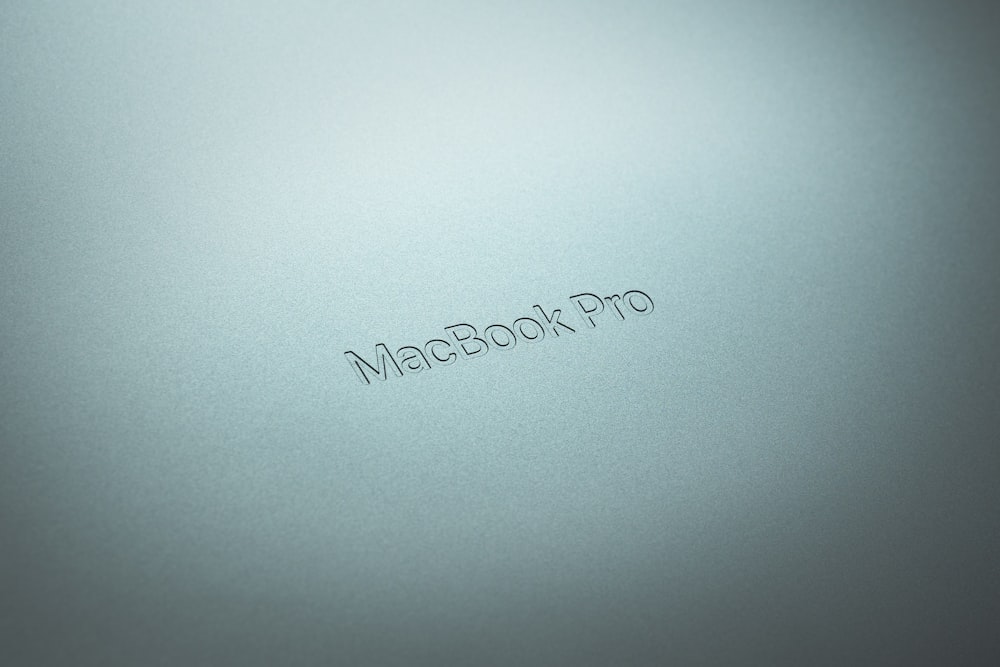 a close up of a macbook pro logo