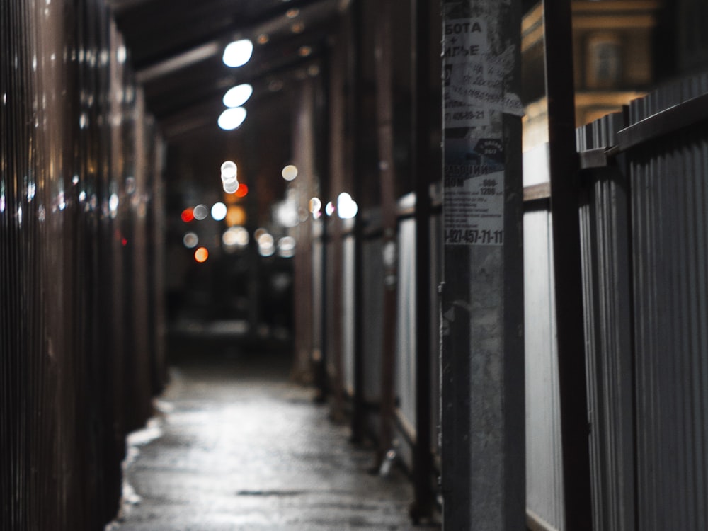 a long hallway with a sign on the side of it