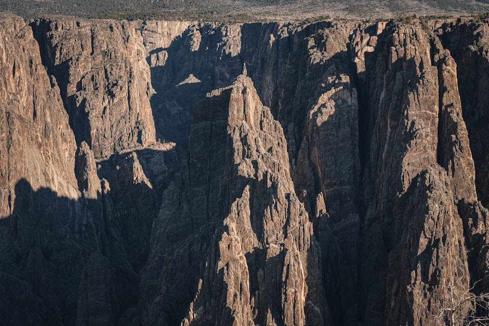 a large canyon with a mountain in the background