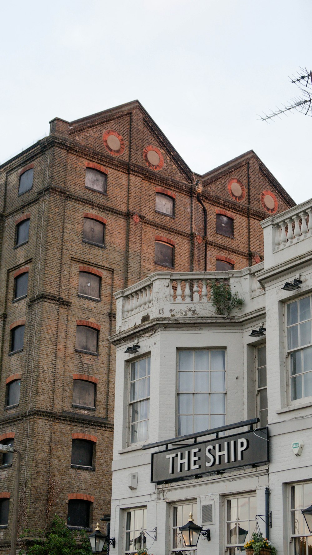 a building with a sign that says the ship