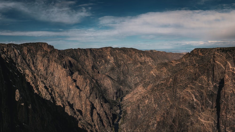 a view of the mountains from the top of a mountain