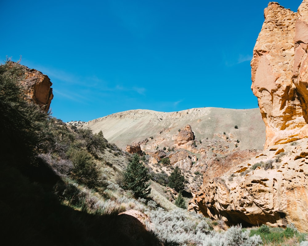 a large rock formation in the middle of a desert