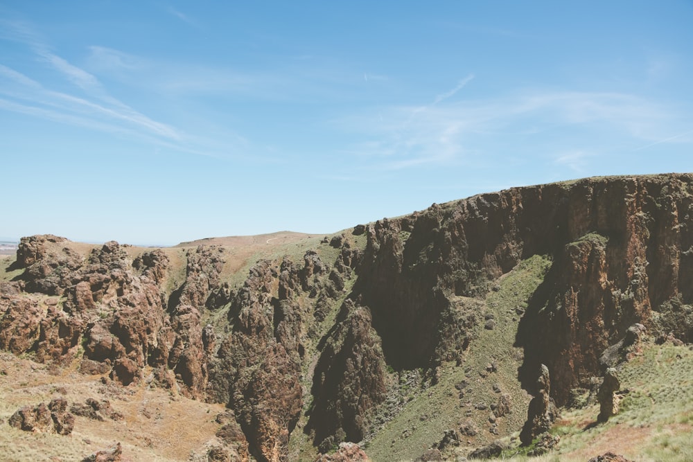 a view of a canyon with a mountain in the background