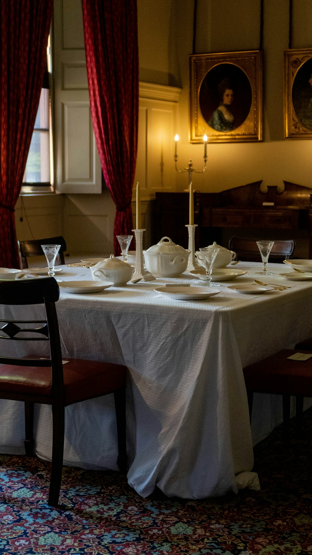 a dining room with a table and chairs