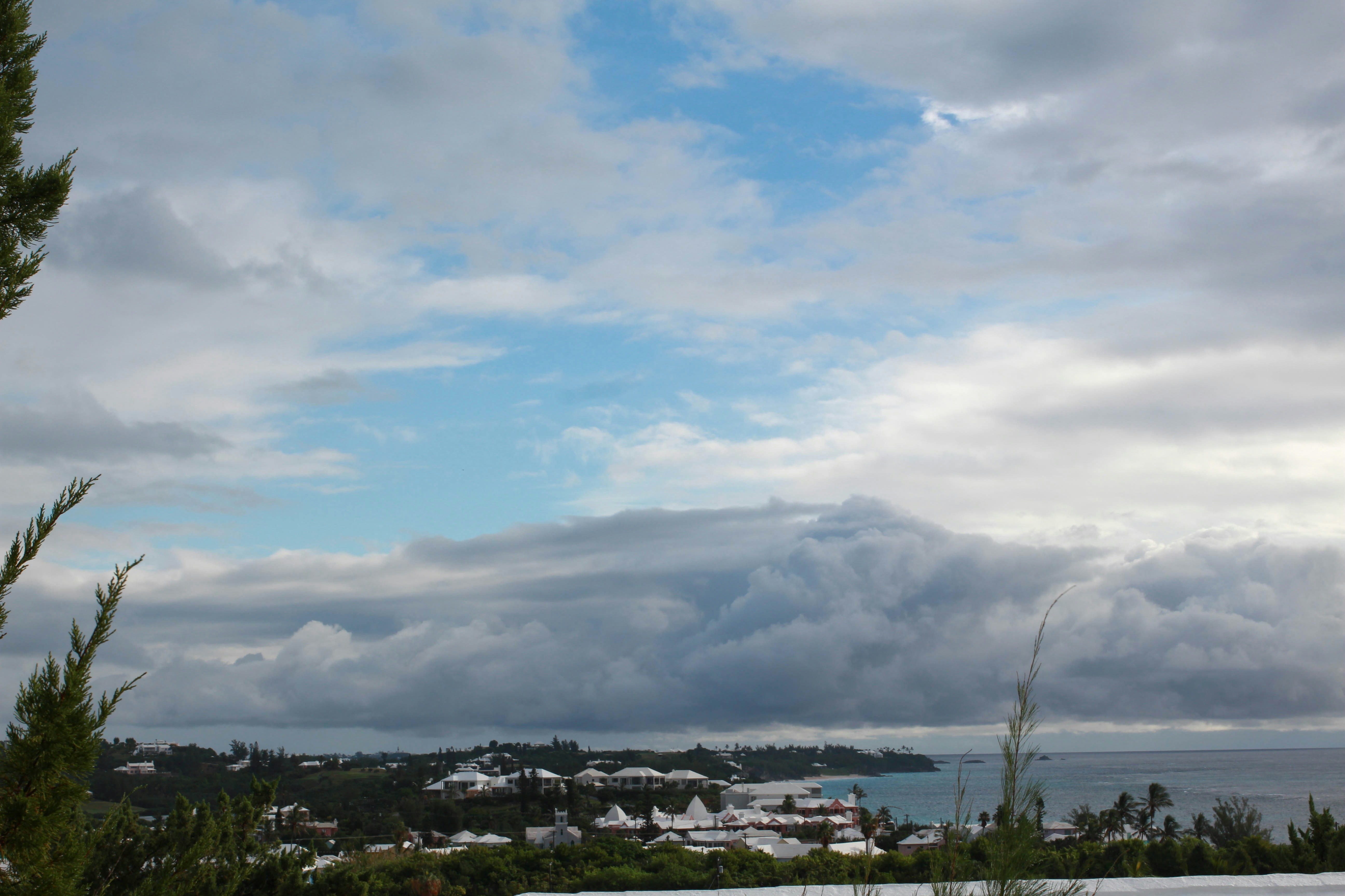 a view of the ocean from a hill, 