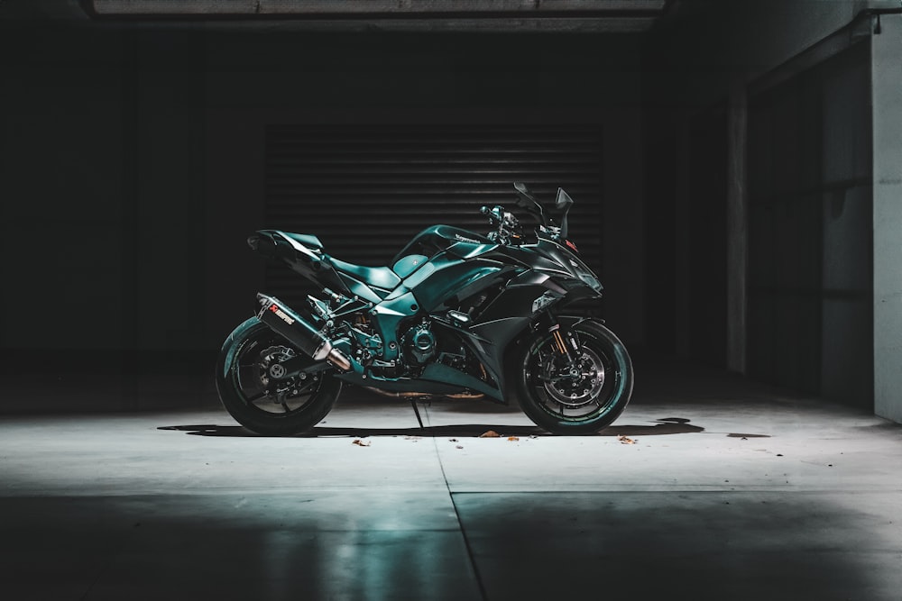 a motorcycle is parked in a dark garage
