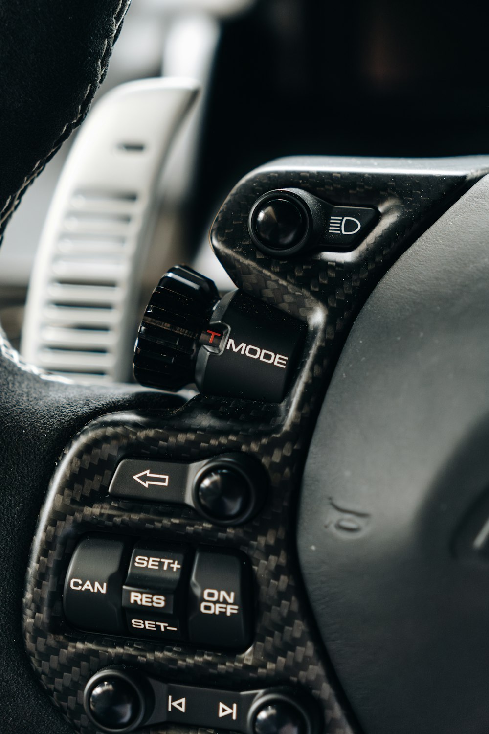 a close up of a steering wheel of a car