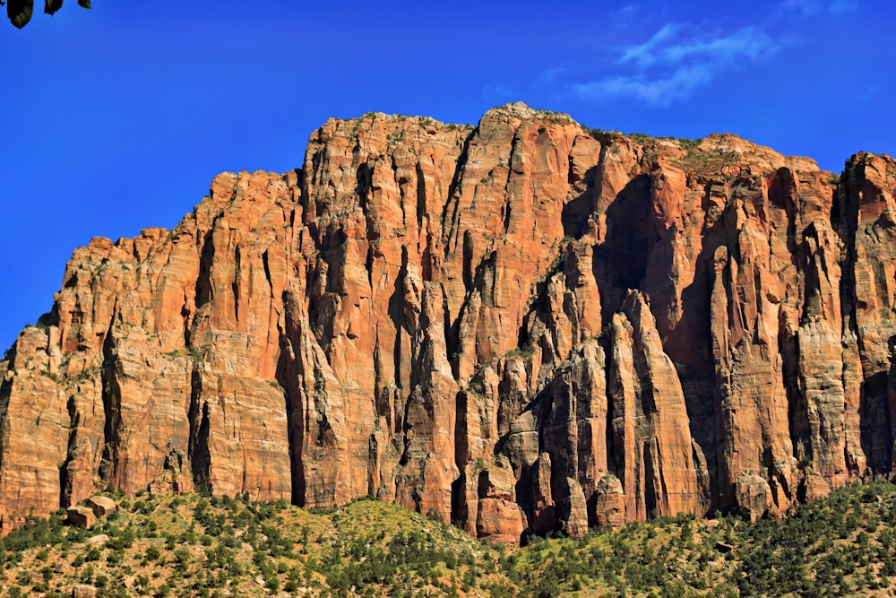 a large mountain with some very tall rocks